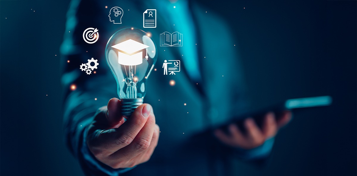 Business professional holding a glowing lightbulb symbolizing innovation and training as part of effective PRM Strategy.